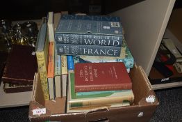 A selection of reading material, including Wine Buyers Guides, A History of Crusades, and others