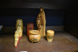 A 20th Century polished olive wood study of Mary, Joseph and Baby Jesus, measuring 24cm high,