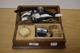 A wooden music jewellery box, containing a collection of wristwatches and bracelets, including