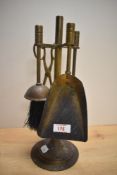 A vintage miniature brass fireside companion set, measures 35cm.