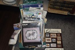 A selection of cross stitch pattern kits.