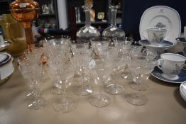 A selection of etched glassware comprising decanters and desert bowls etc.
