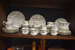 A selection of mid-20th Century S&N. L. china teaware hand painted in a foliate design