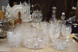 An assortment of glassware consisting mainly of cut glass comprising goblets, decanters, biscuit