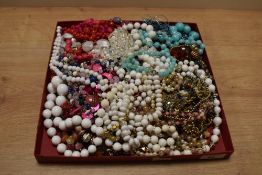 A large assortment of costume jewellery, including statement pieces, beaded necklaces and chains,