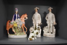 Two late Victorian Staffordshire Pottery Baden Powell figues, modelled standing aside a cannon,