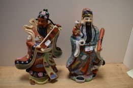 A 20th Century Chinese polychrome study of a Wise Man, measuring 37cm high, and a similar polychrome