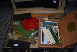 A small assortment of writing equipment in a hard leather case.
