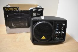A Behringer Eurolive 150 Watt compact monitor system, with box, powers up and sound through each