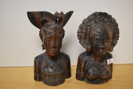 Two attractive Balinese carved hardwood busts, each with elaborate headdress, appears to be a
