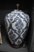 A large modern blue and white pottery table lamp, roughly of Meiping shape with domed surmount and