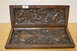 Two late 19th Century Gothic oak rectangular panels, each decorated with a stylised leaf design