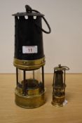 An antique brass and painted metal miners lamp, of traditional design but unmarked with makers
