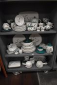 A large collection of Denby Green Wheat patterned tableware, to include teacups and saucers, egg