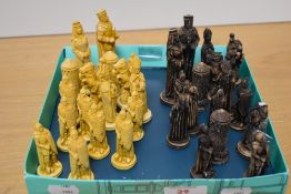 A cast-resin chess set, formed as medieval kings, queens, knights, bishops, castles and soldiers