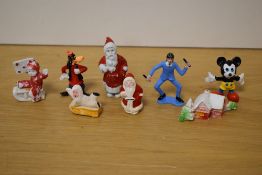 A selection of vintage confectionary/cake decorations in bisque porcelain and moulded plastic, to