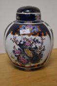 A 20th century Chinese pottery ginger jar, decorated with peacocks, foliage and diaper borders,