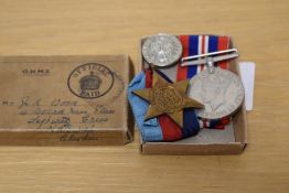 Two World War II British military medals, comprising the 1939-1945 medal and the 1939-1945 star,