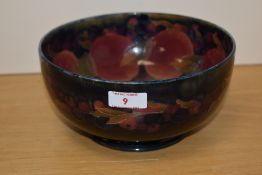 A (William) Moorcroft pottery Pomegranate pattern bowl, of dished circular form tube-lined in the
