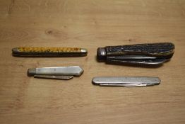 A Mother of Pearl pen knife sold along with three other pen knives, with one bearing initials.