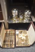 An assortment of silver plated ware comprising two coffee pressers, napkin rings, a small tray as