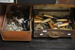 Two leather cases containing vintage hand tools, including a Stanley planer, chisels, and files
