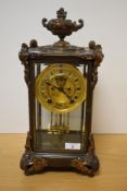 An American 'Ansonia' gilt brass four glass striking mantel clock, having ornate urn form surmount