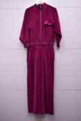 A 1970s William Travilla one-piece boilersuit or jumpsuit in fuschia pink velour, featuring wide