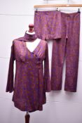 A 1960s four-piece disco set in brown and purple swirling-foliate patterned rayon jersey, comprising