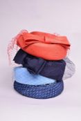 Four 1950s ladies formal occasion hats. A pillbox hat, made in England, in midnight blue nylon, with
