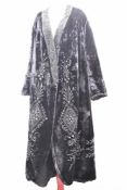 A late 19th century high Victorian / early Edwardian long jacket in black velvet, highly decorated