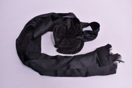 Five black Victorian clothing and accessory items. A Victorian coat in finely woven black