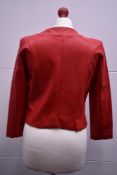 A 1990s pillarbox red Italian leather jacket with matching gloves, collarless, crew neck, having a