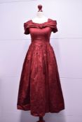 A 1950s House of Nicholas London girls bridesmaid dress, in burgundy silk, featuring an open