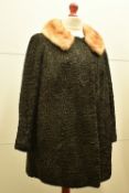 A 1950s Daniele Tedaldi of Zurich car coat, in black Persian lambswool, with a flat laid wide
