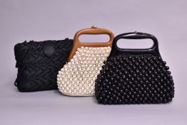 Three small structural ladies bags. A 1970s handbag, heavily beaded with spherical wooden beads