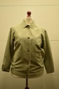 Two poly-cotton jackets in light shades. A 1960s Breckmoor Made in the UK rain coat, in taupe