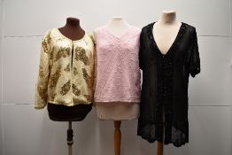 Three beaded tops. A black crepe eyelet button-up tunic, with short sleeves, decorated with black