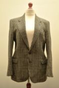 A 1980s single breasted coat in black and white 100% Pure New Wool houndstooth, flecked with threads