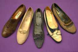 Five pairs of mid-century style low heeled casual women's shoes. A pair of Gabor brown leather co