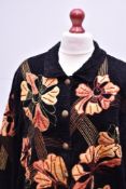 A 1980s Indigo Moon coach jacket in black chenille, featuring all over geometric embroidery and