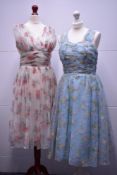 Two 1950s floral summer eveningor occasion dresses, one labelled Kinross Model Made in England,
