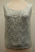 A 1960's pale blue iridescent beaded vest top, in fine knit wool and lined with silk, with an all-