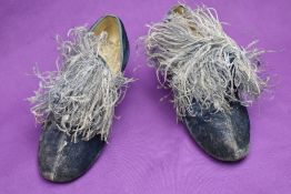 A pair of 1940s dancer's shoes, in blue crushed velvet and featuring a powder blue ostrich feather