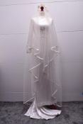 Four 1960s wedding items, comprising one bride's dress , a veil and two bridesmaids' dresses, all in