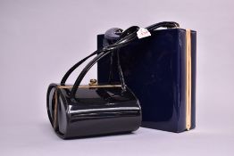 Two structured patent occasion handbag. A St Michael box bag in patent navy blue leather look,