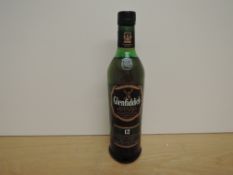 A bottle of Glenfiddich 12 Year Old Single Malt Scotch Whisky, Signature Malt, 40% vol, 70cl