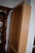 A tall and slender modern beech effect bookcase with adjustable shelving 21.5cm x 45cm x 20cm