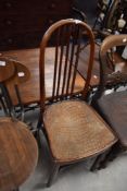 An interesting Thonet bentwood bistro chair, with arched and slatted back over the moulded crocodile