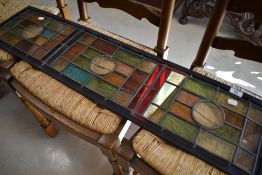 A decorative leaded glass and stained panel, approx. 101 x 24cm